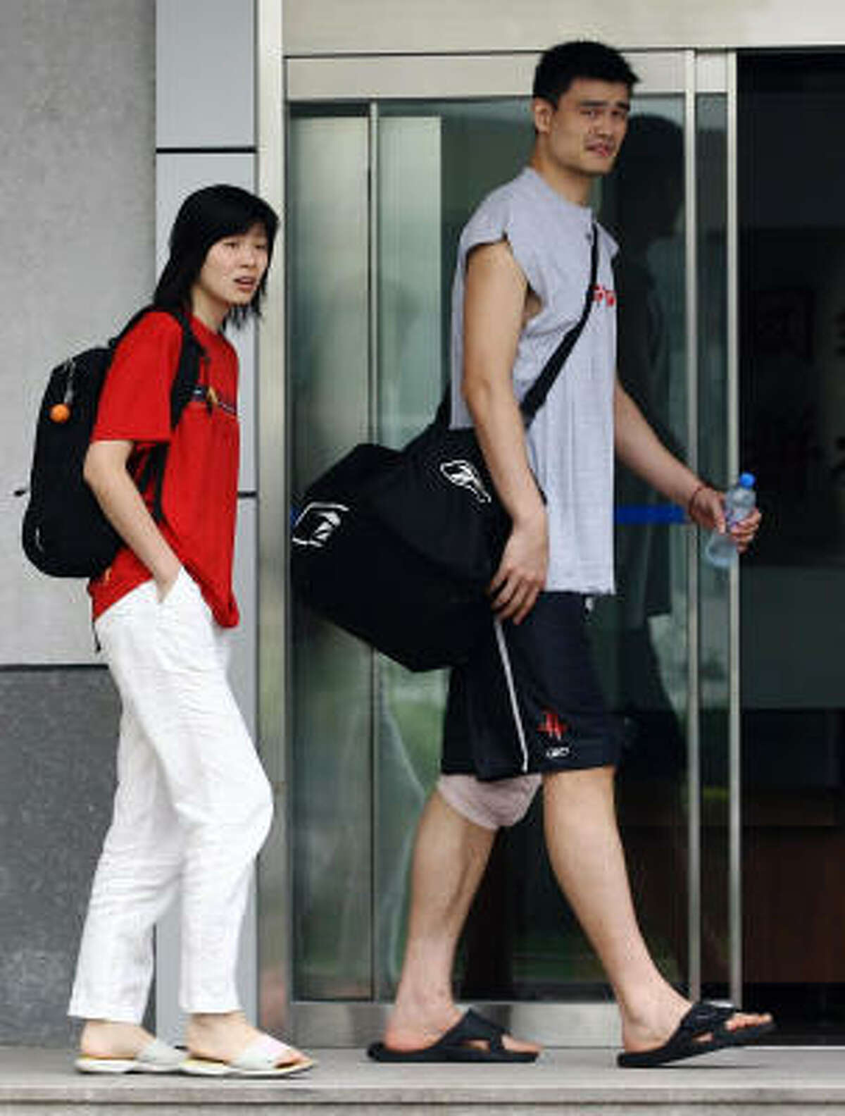 A recent undated photo of Yao Ming, who has kept his love life closely guarded from the media, with his teenage sweetheart Ye Li, in Beijing. Yao and Ye will wed today, after an eight-year courtship, in a family-only ceremony in Shanghai, where they were born, met and began dating.