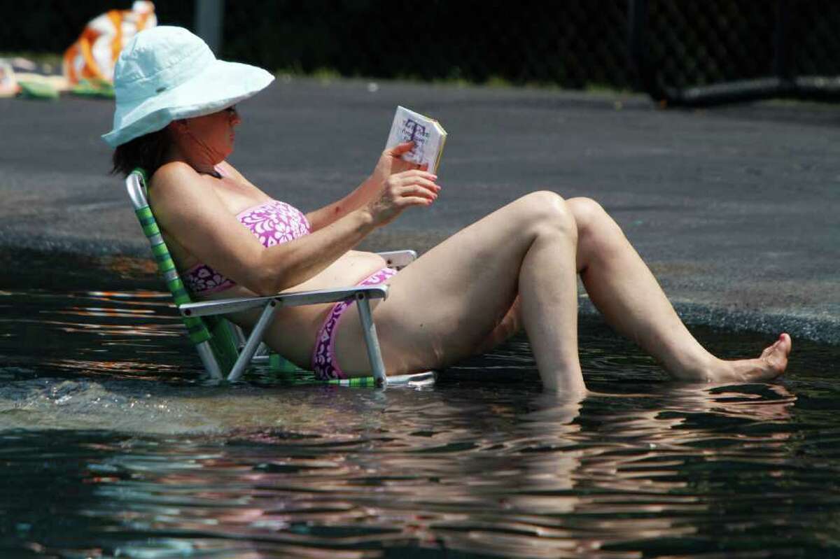 A woman enjoys the cool of the pool on Wednesday, July 20, 2011 in Montpelier, Vt.