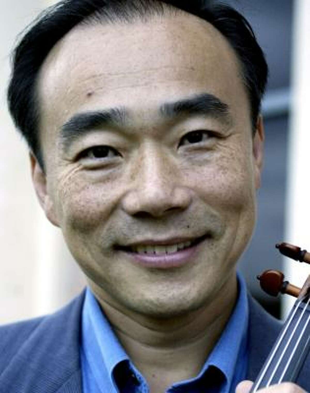 Violinist Cho-Liang Lin, an internationally acclaimed performer who has recently joined the faculty of Rice University's Shepherd School of Music, poses for a photograph on Friday, September 29, 2006 outside the Alice Ptratt Brown Hall. (Jessica Kourkounis/For The Chronicle)