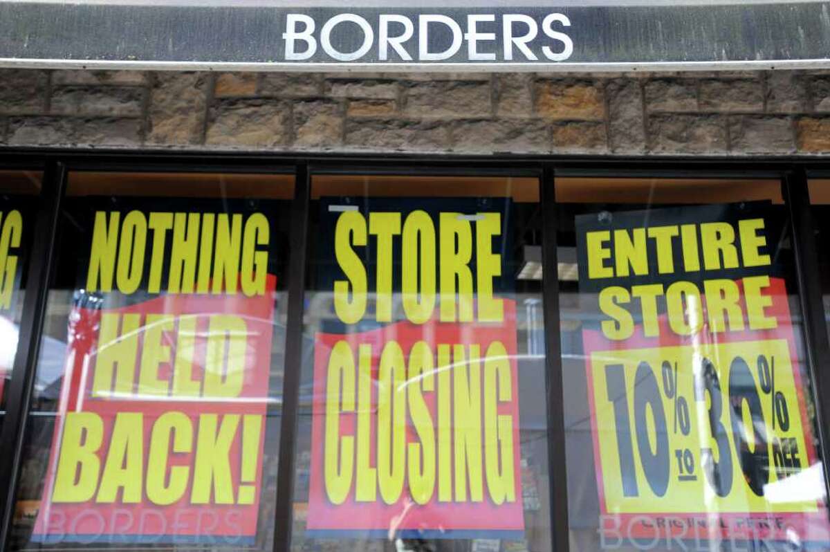 Store closing signs are posted on the exterior of the Borders book store in Ann Arbor, Mich., Friday, July 22, 2011. Borders Group began liquidation sales at all of its 399 stores as the 40-year-old chain winds down operations.