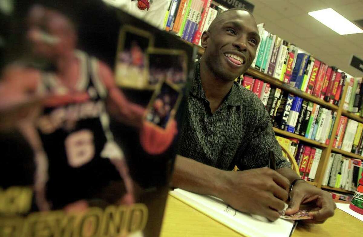 Former Spurs guard Avery Johnson was on hand at Borders to autograph his new book, "Reach Beyond The Break; The Avery Johnson Story, Thursday evening, October 31, 2002.