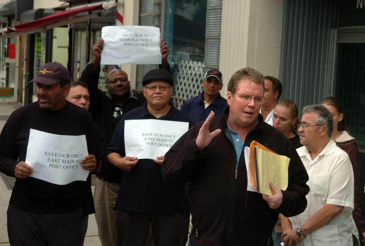 Michael Dennehy, president of the Bridgeport chapter of the American Postal Workers Union, talks to supporters of the Noble Postal Station Tuesday Sept. 29, 2009 outside the Bridgeport, Conn. office which is on a list to be closed later this year.
