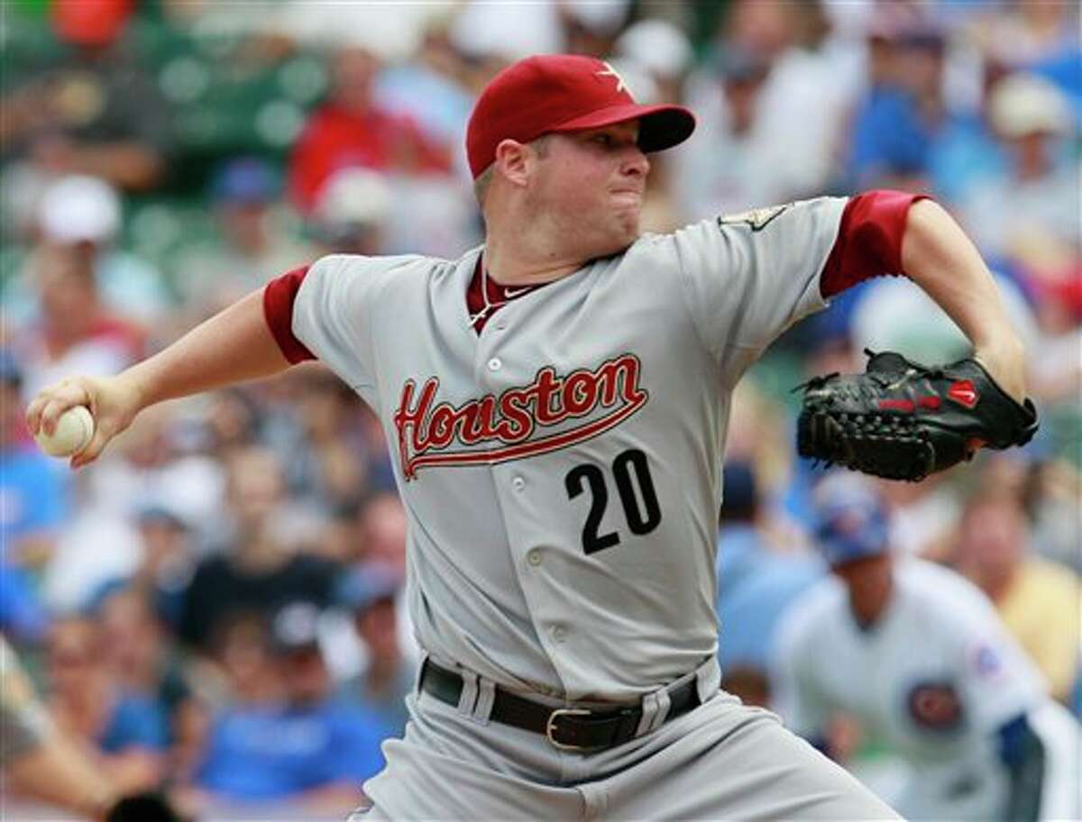 Houston Astros starter Bud Norris throws during the first inning of a baseball game against the Chicago Cubs, Friday, July 22, 2011, in Chicago. (AP Photo/Nam Y. Huh)