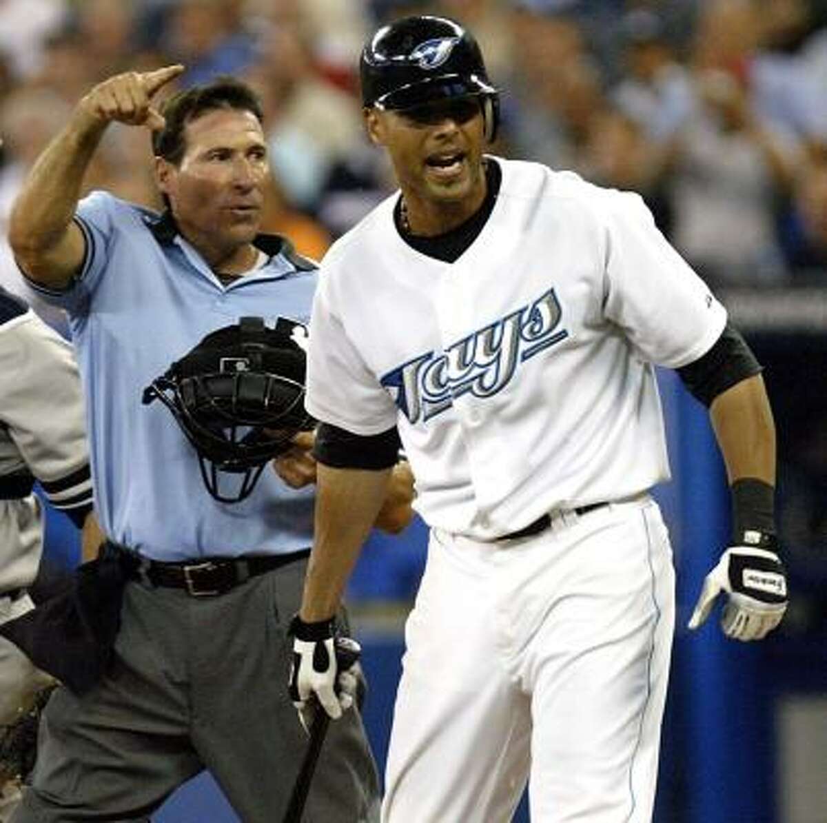 Umpire Angel Hernandez ejects Roger Clemens for hitting Alex Rios, right, during the seventh inning of Tuesday's game.