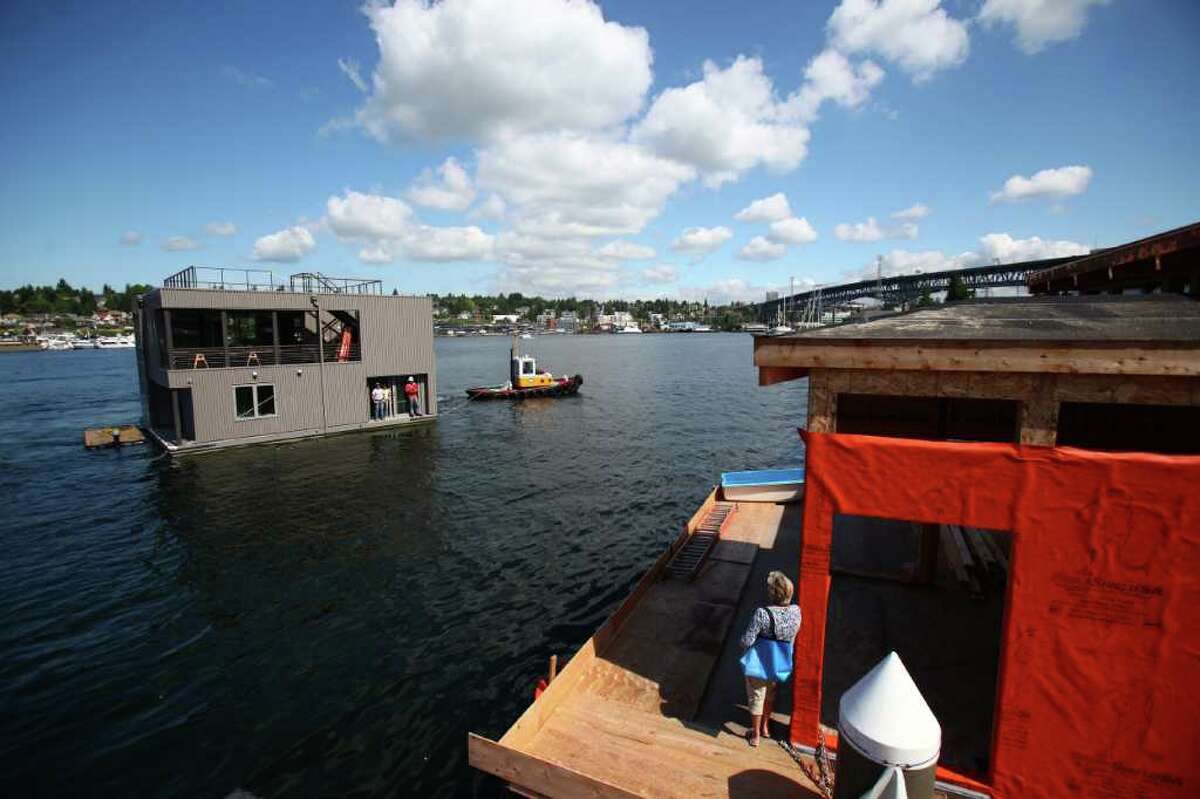 A floating home enters Wards Cove, a new floating home community in Seattle's Eastlake neighborhood on Friday, July 22, 2011. The floating home slips at Wards Cove are billed as the last new floating home spots available on Lake Union.