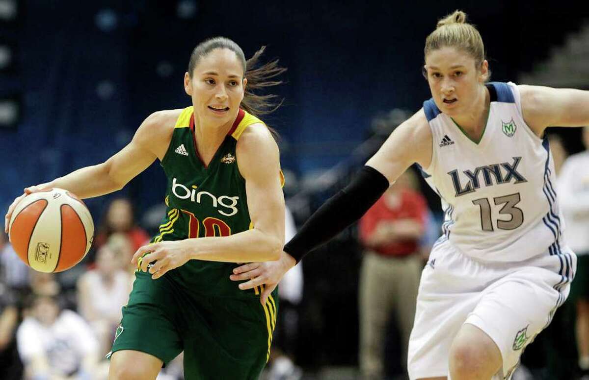 Seattle Storm guard Sue Bird drives past Minnesota Lynx guard Lindsay Whalen in the first half of an WNBA basketball game, Saturday, July 16, 2011, in Minneapolis. (AP Photo/Stacy Bengs)
