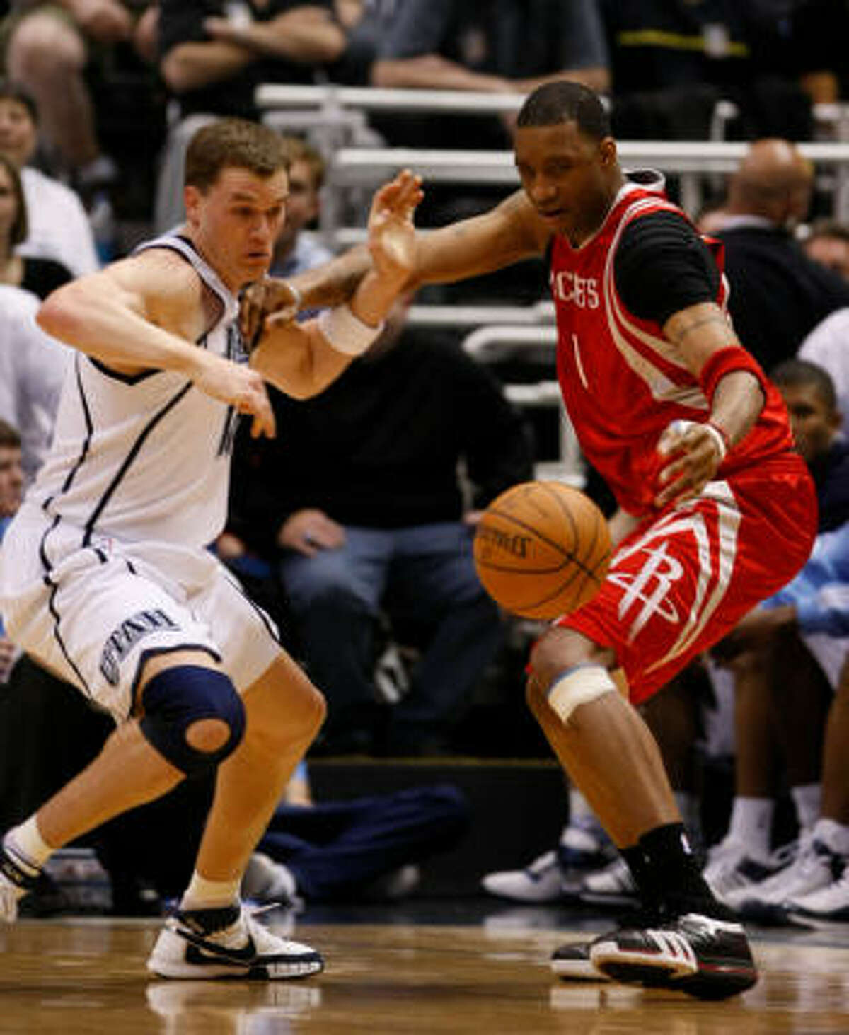 Jazz forward Matt Harpring, left, steals the ball from Rockets guard Tracy McGrady in the fourth quarter of Game 4.