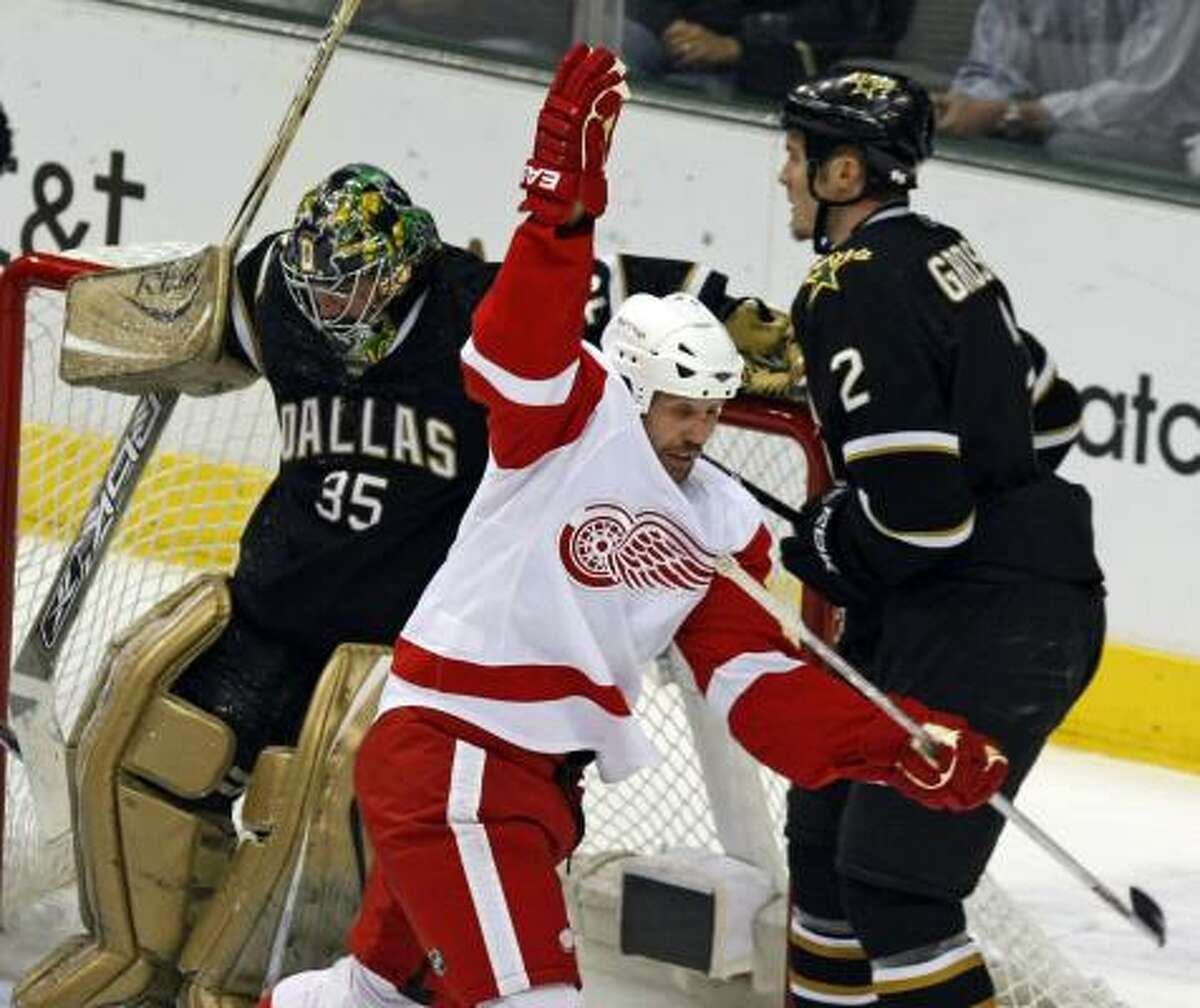 Detroit's Dallas Drake (17) celebrates after beating Stars goalie Marty Turco in the first period.