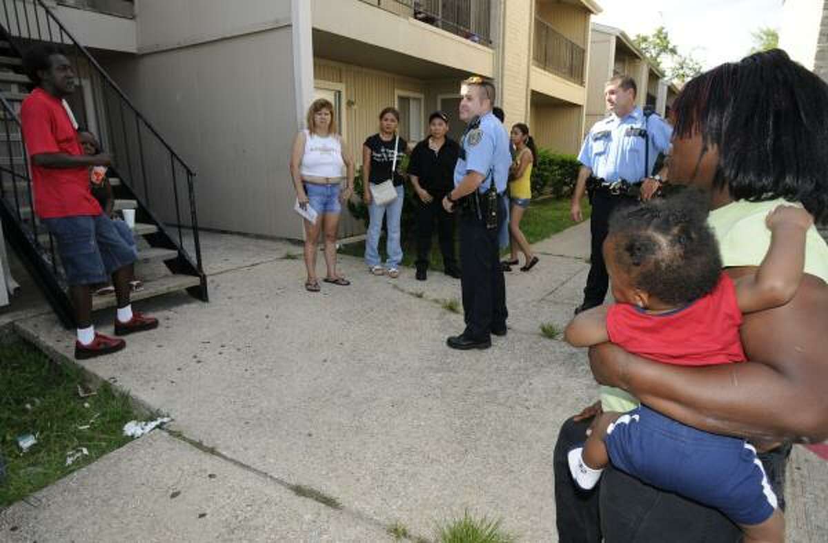 Houston police officers tell tenants Tuesday that the city has declared the Gables of Inwood uninhabitable.