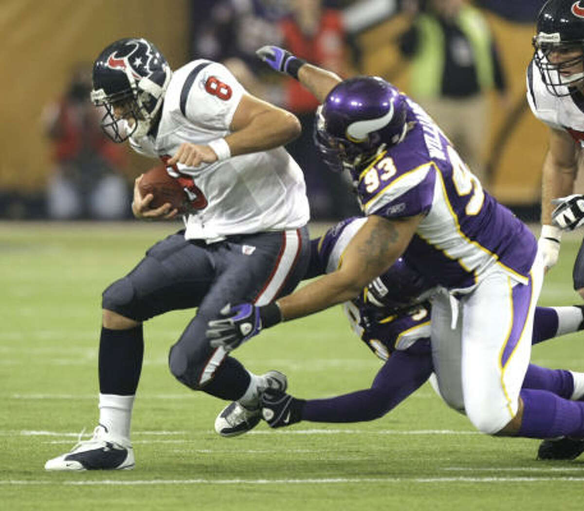 Texans quarterback Matt Schaub (8) is sacked by Vikings defensive end Ray Edwards (91) and defensive tackle Kevin Williams (93) during the first quarter.