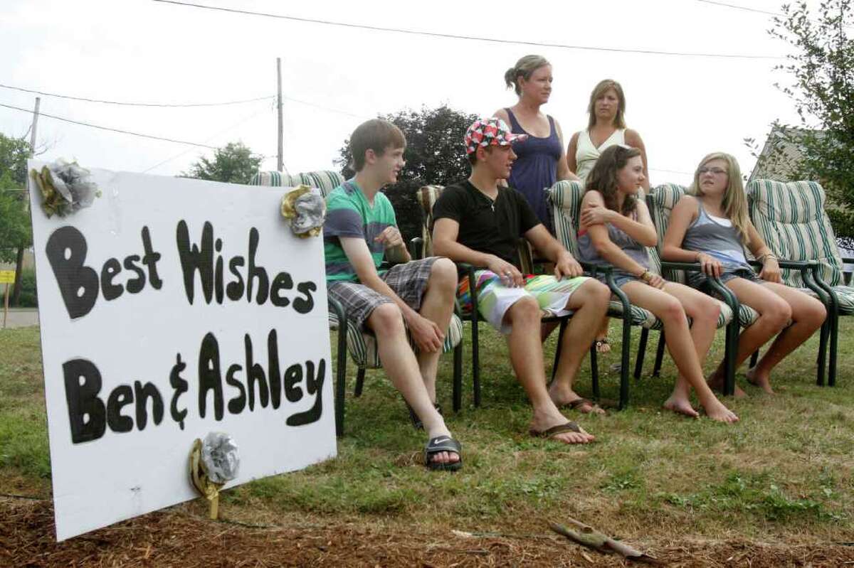 The Zierenberg family sits in lawn chairs in the front yard waiting for Pittsburgh Steelers quarterback Ben Roethlisberger and his new wife, Ashley Harlan of New Castle, Pa. to pass by after their wedding just down the street from their home in Sewickley, Pa. on Saturday, July 23, 2011 in (AP Photo/Keith Srakocic)