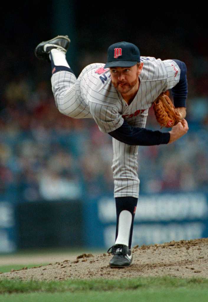 FILE - In this Oct. 12, 1997, file photo, Baltimore Orioles' Roberto Alomar  throws out Cleveland Indians' Bip Roberts to end the fourth inning of Game  4 of the American League Championship Series at Jacobs Field in Cleveland,  Ohio. Alomar and Bert