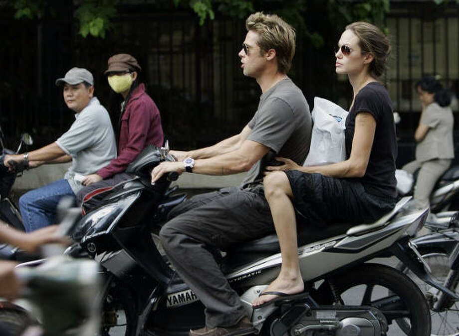 brad pit and angelna joli on a bike