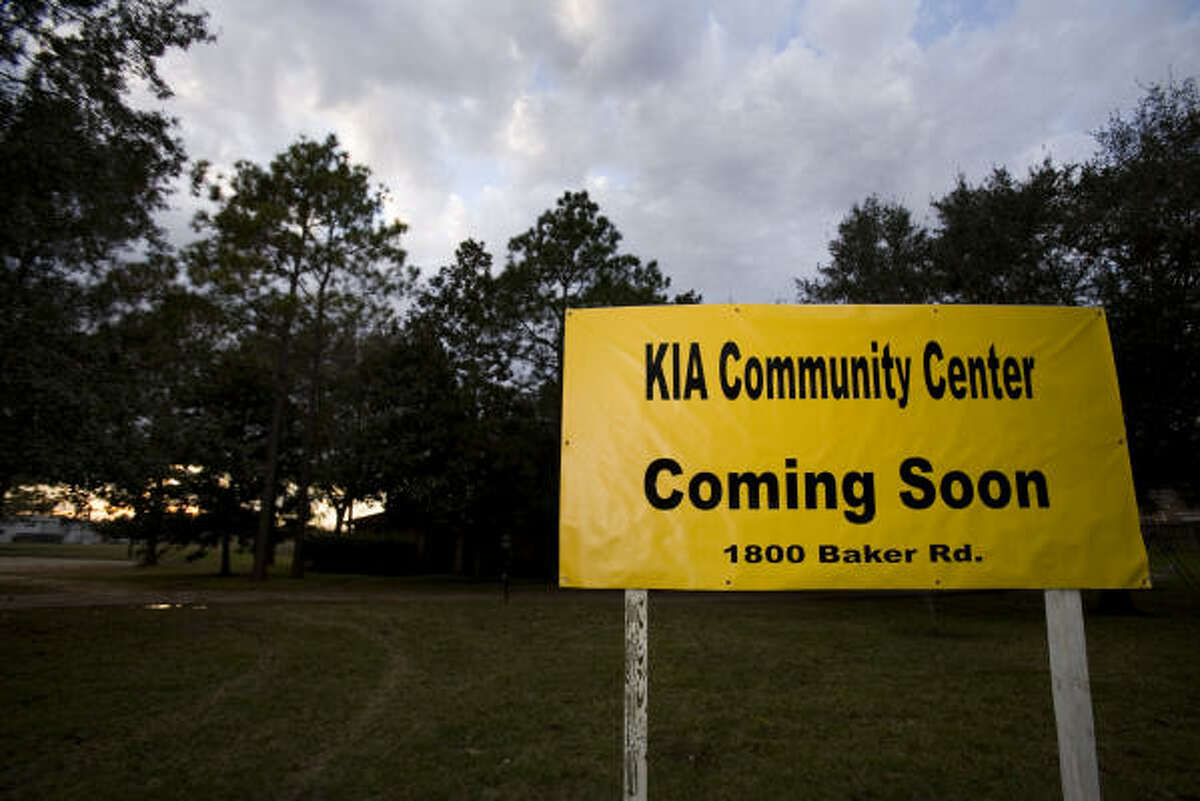 A sign advertising "KIA Community Center Coming Soon" is seen on land for a proposed mosque near Katy.