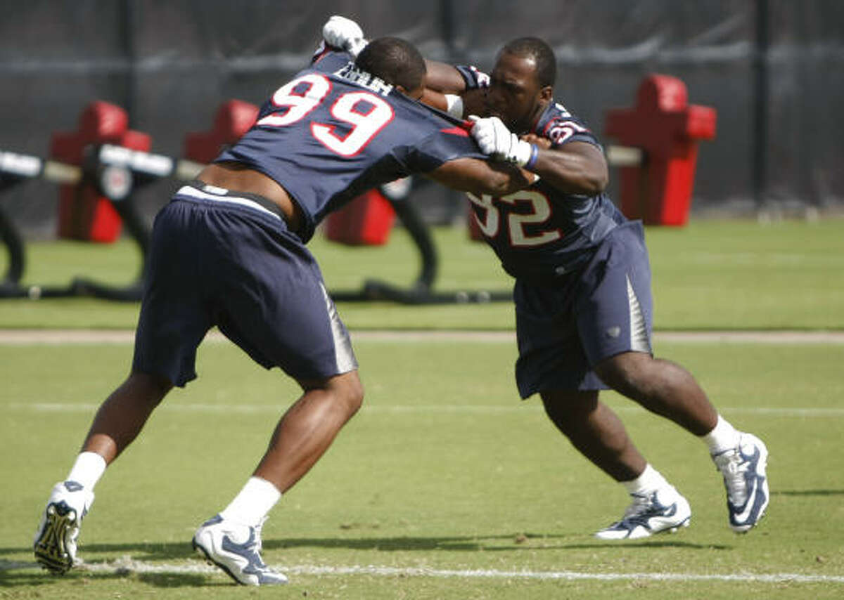 Earl Mitchel, right, fits in with the rest of the experienced defensive line and has gotten a few repetitions against the first team offensive line in practice.
