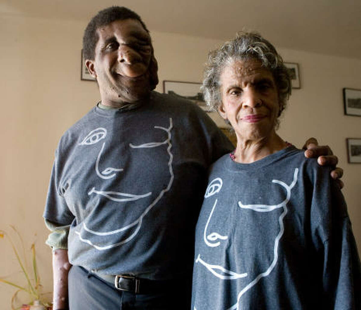 Reggie Bibbs and his mother, Dorothy Bibbs, wear their their "Just Ask!" shirts. Reggie Bibbs received a reward for his "Just Ask!" campaign.