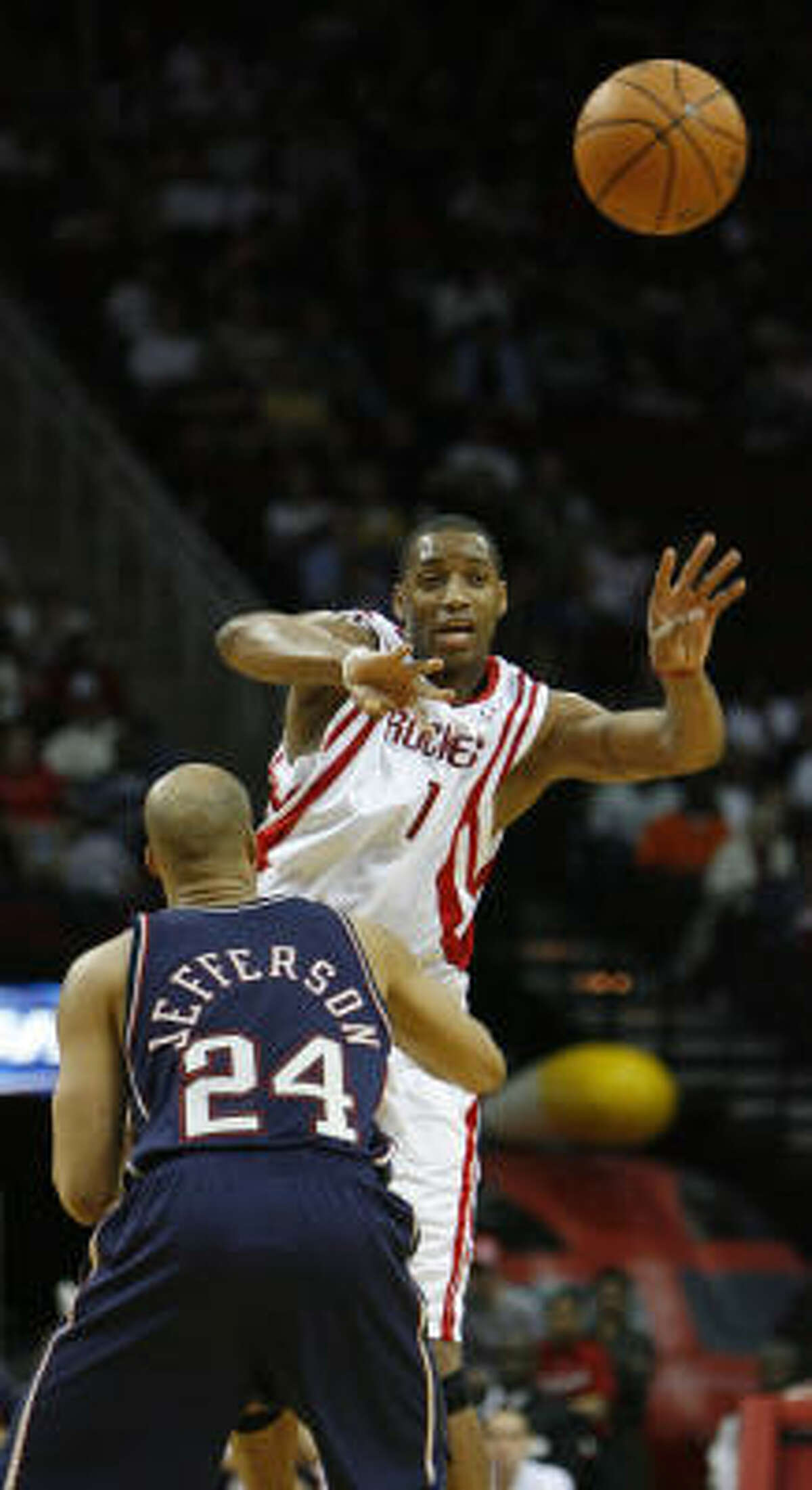 Tracy McGrady's 34 points helped the Rockets get a win over Richard Jefferson and the New Jersey Nets.