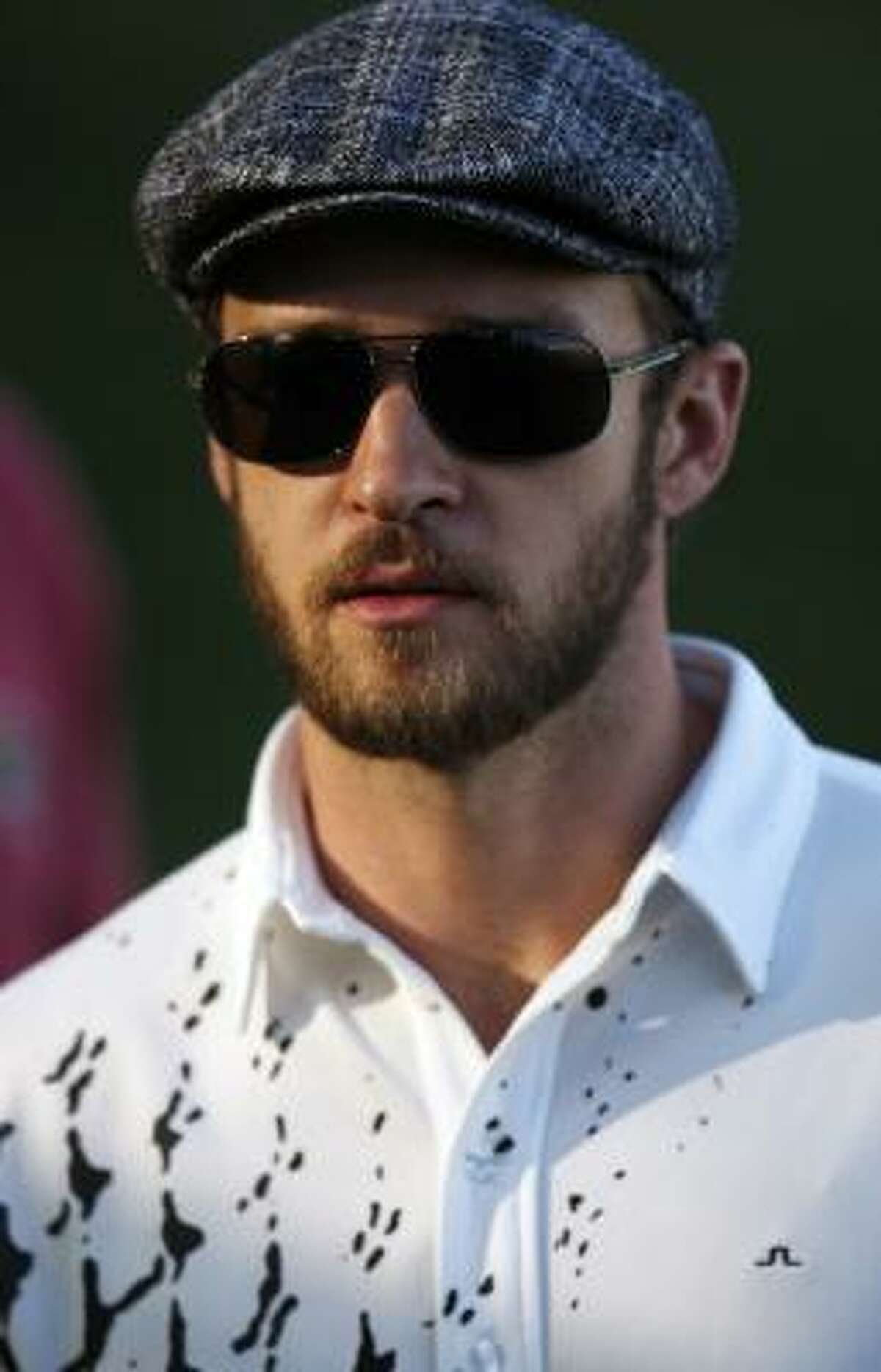 Justin Timberlake sports the flat cap on the golf course.