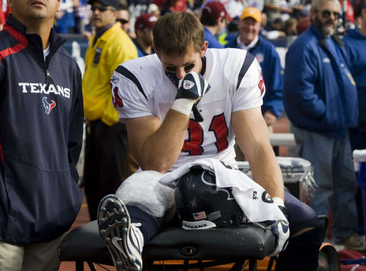Texans tight end Owen Daniels sits on the bench after leaving Sunday's game with a sprained right knee.
