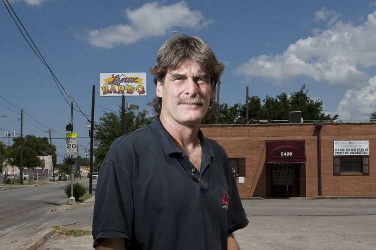 Erik Mrok, owner of Lenox Barbecue, stands ﻿outside his ﻿restaurant that has closed due to Metro light rail line construction.