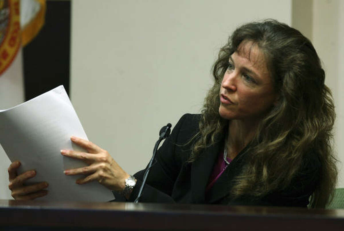 Former astronaut Lisa Nowak, on the witness stand, answers questions during a hearing at the Orange County courthouse in Orlando, Fla. on Sept. 19.