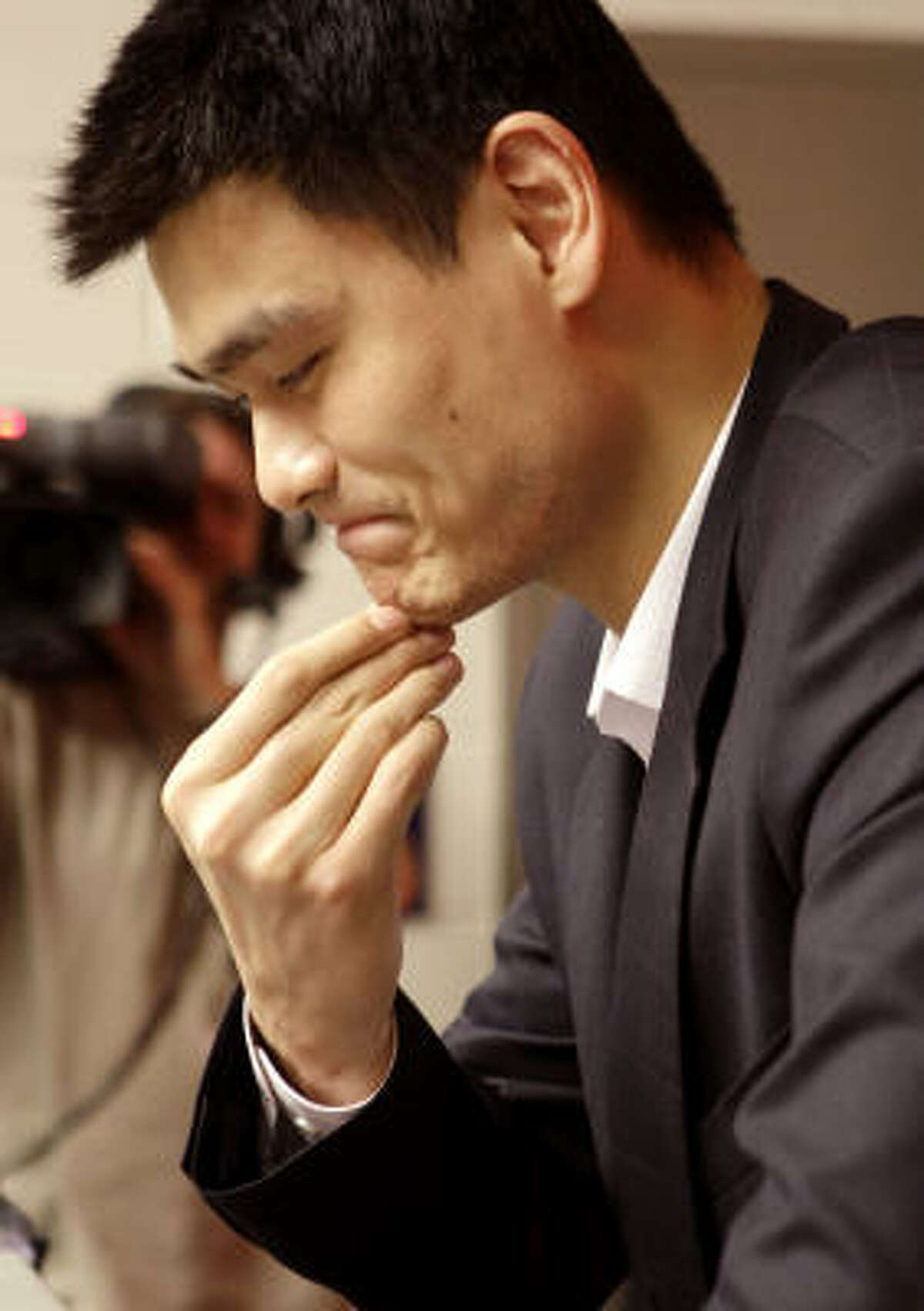 Houston Rockets center Yao Ming answers questions during a news conference after the announcement that Yao will be out for the season with a stress fracture to his left foot Tuesday, Feb. 26, 2008, in Houston.