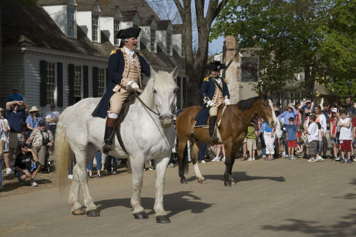 Actors portraying George Washington and the Marquis de Lafayette re-enact a scene for visitors to Colonial Williamsburg.