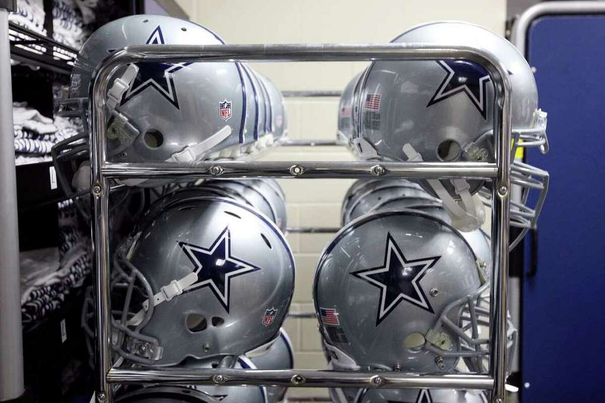 Cowboys helmets are stacked at the Alamodome on Monday, July 25, 2011, as the team's equipment began to arrive. The Cowboys are expected to begin training camp practices Thursday.