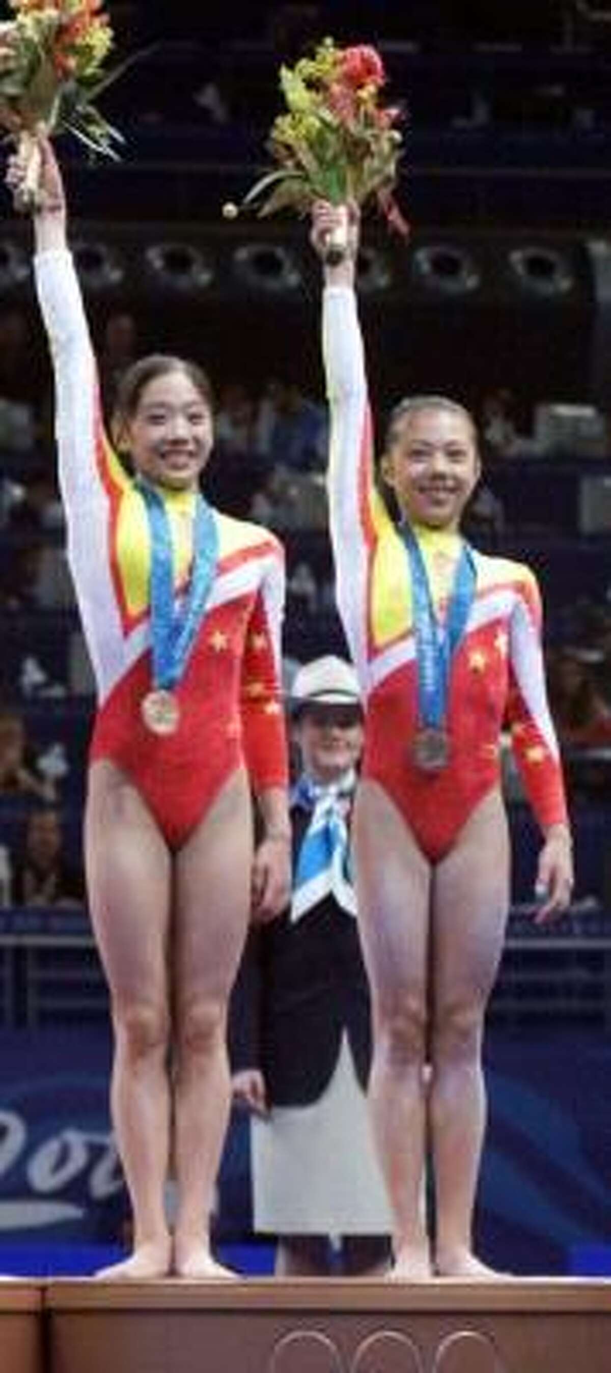 The International Olympic Committee determined Dong Fangxiao, right, was only 14 at the 2000 Sydney Olympics.