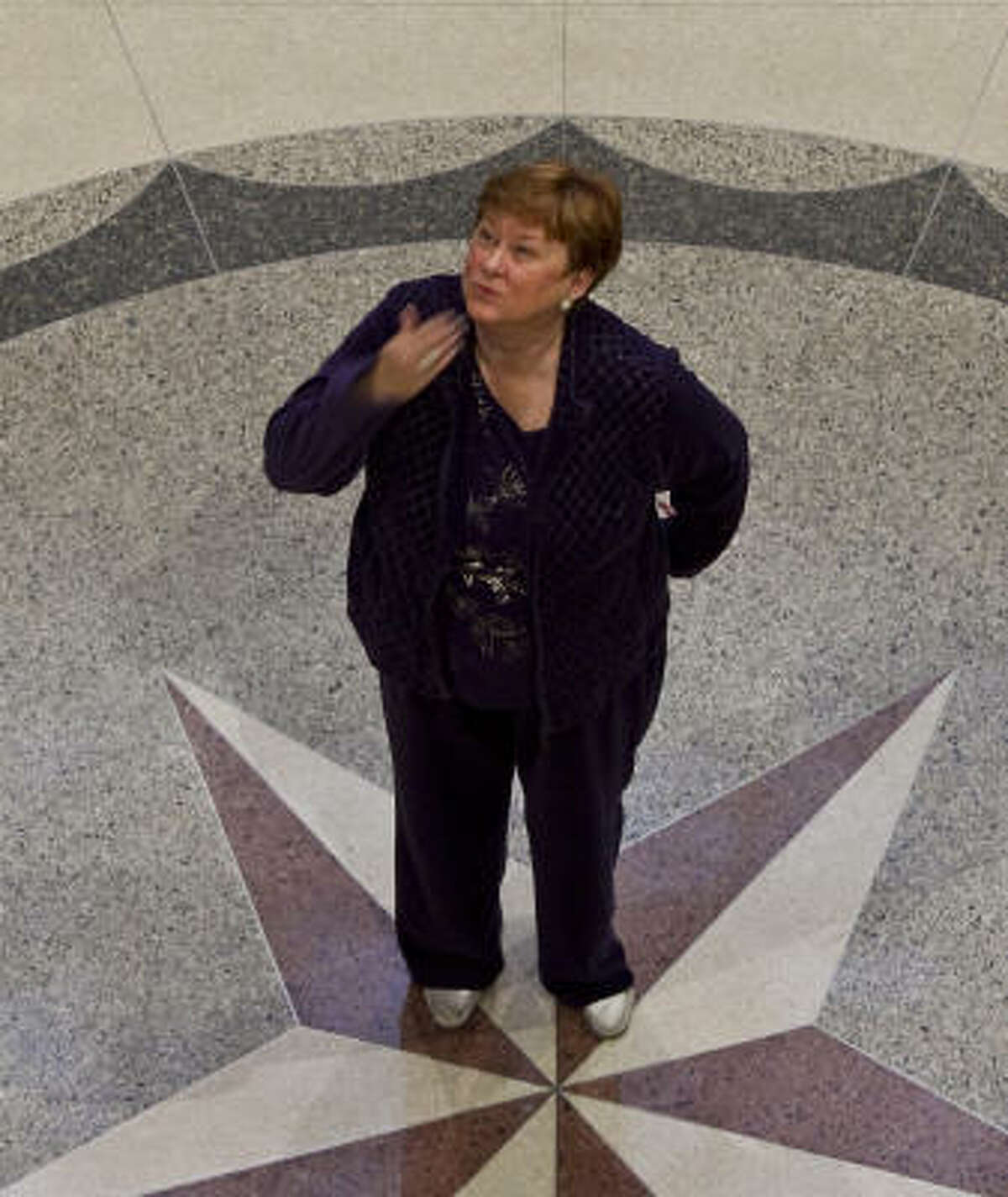Beverly Kaufman blows a kiss to a friend Wednesday on her last day of work as Harris County Clerk. After nearly 17 years, she's set her sights elsewhere. "I don't want to go with my boots on," Kaufman said.