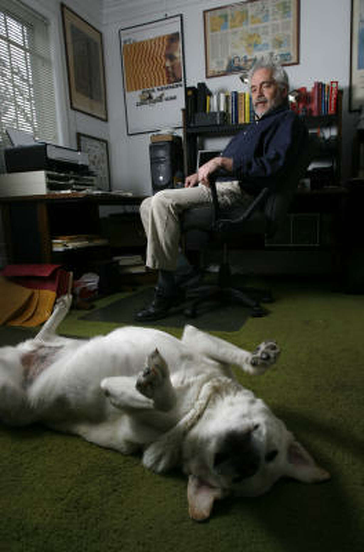 Gary Taylor, a Houstonian who ﻿self-published his book, Luggage by Kroger: A True-Crime Memoir, hangs out with his dog, Shane, at his home, where much of his book was written.﻿