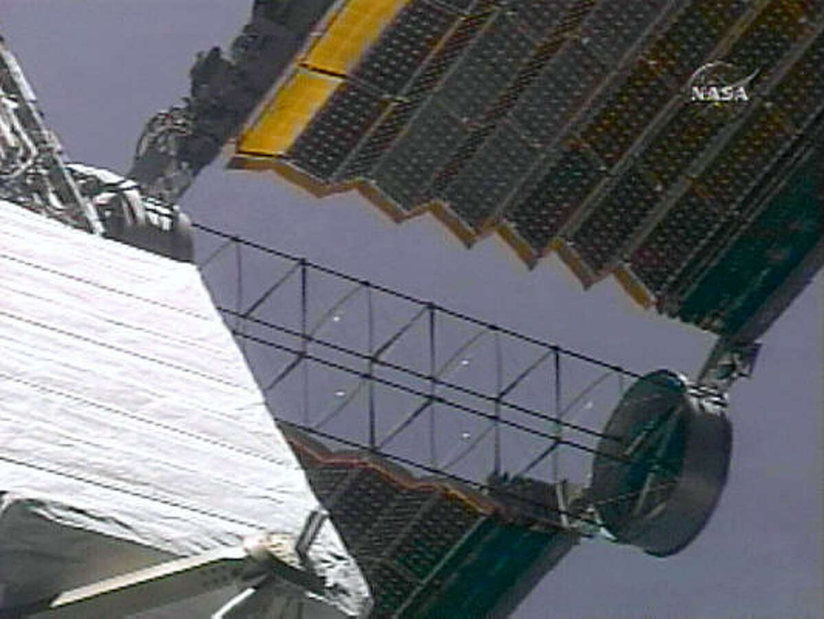 The international space station begins a solar array extension today after work was completed astronauts Scott Parazynski and Doug Wheelock.