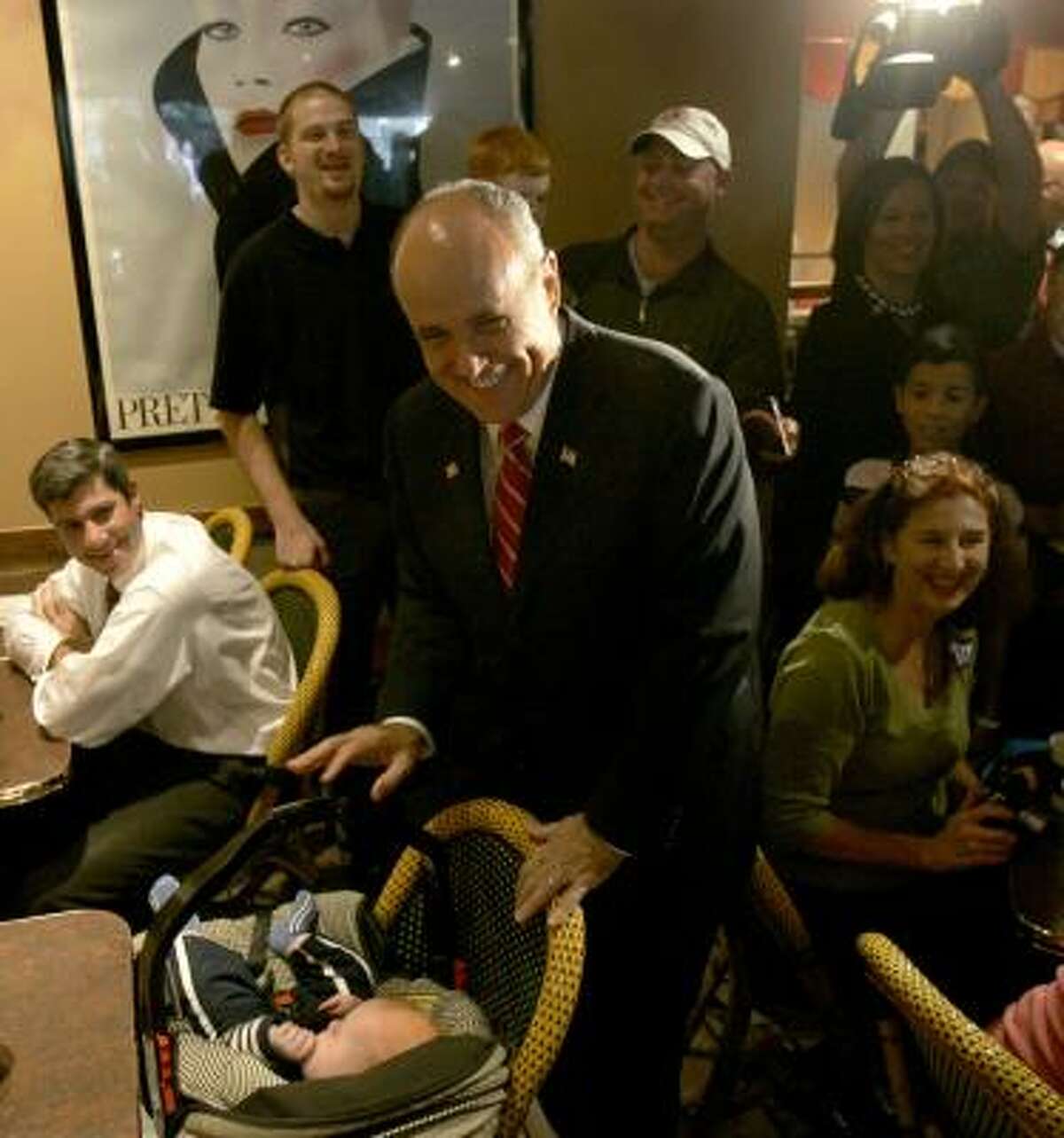 Republican presidential hopeful Rudy Giuliani greets 5-month-old Birch Carter in Clayton, Mo.