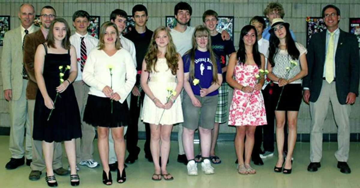 SPECTRUM/Thirteen students at Shepaug Valley High School in Washington were recently inducted into the school's Tri-M Music Honor Society. Among those on hand for the June 11 ceremony were, from left to right, front row, Amanda Taylor, Katherine Tracy, Grace Kellogg, Sarah Irwin, Adrienne Fedyna-Dembeck and Callie Huber, as well as faculty member and Tri M advisor Friso Hermans; back row, faculty members Christopher Shay and Kevin Klepacki, plus inductees Gregory Valentine, Oliver Taylor, Andrew Stern, Jesse Steinmetz, Matthew Dever, Nathan Ong and Jozef Lepelley. Courtesy of Taylor Weston