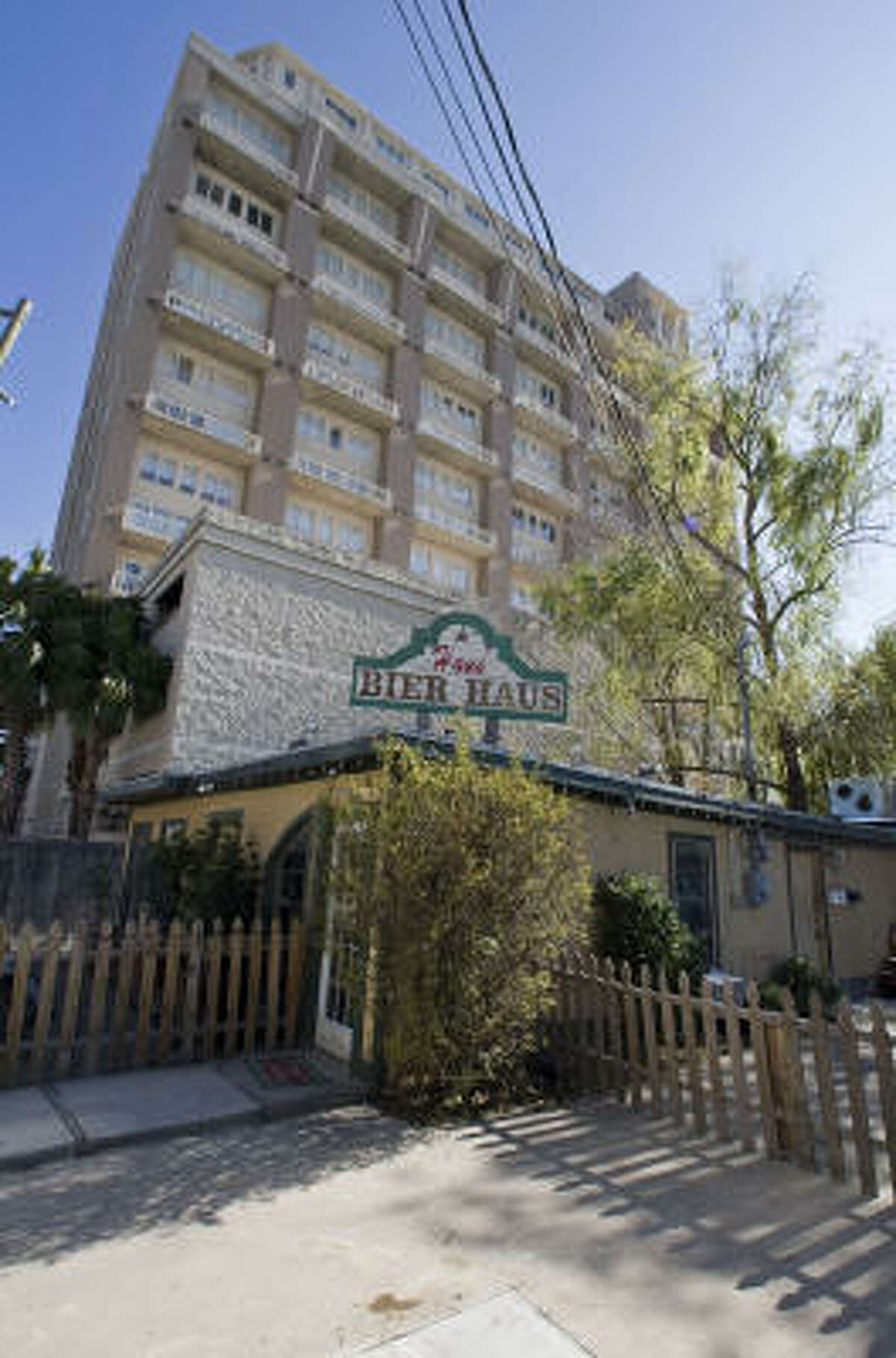 Hans' Bier Haus near Rice Village is situated next door to high rise condominiums with an attached garage on Robinhood Drive.