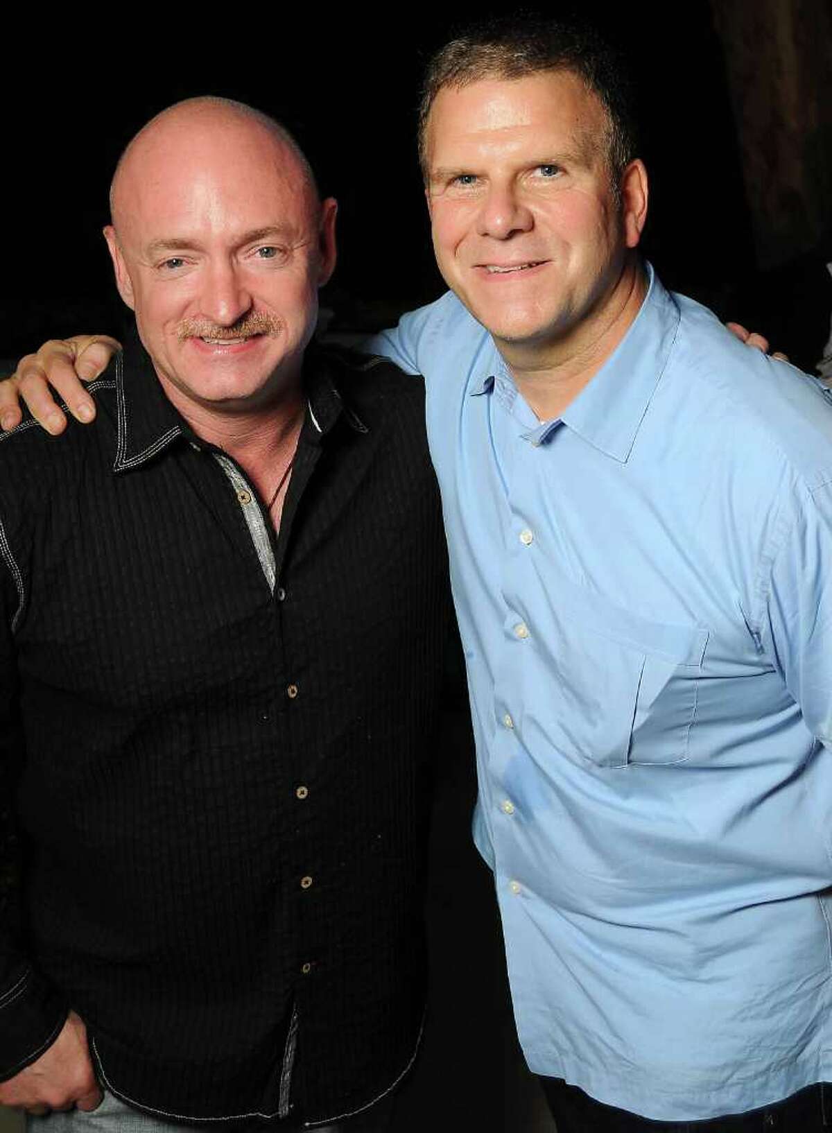 Astronaut Mark Kelly and Tilman Fertitta at the Gathering of Champions benefitting Houston Children's Charity at Fertitta's home Wednesday April 13,2011.(Dave Rossman/For the Chronicle)