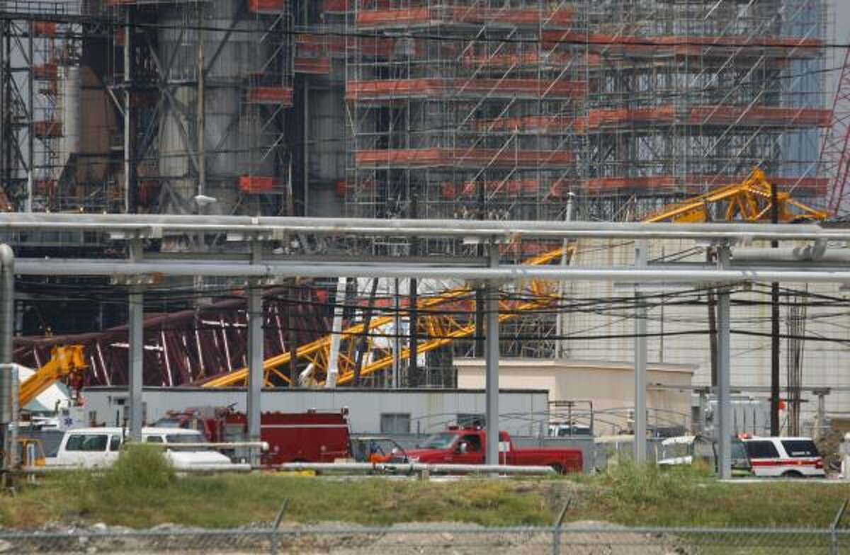 What appears to be a portion of a collapsed crane is visible within the LyondellBasell refinery on Friday in Houston.
