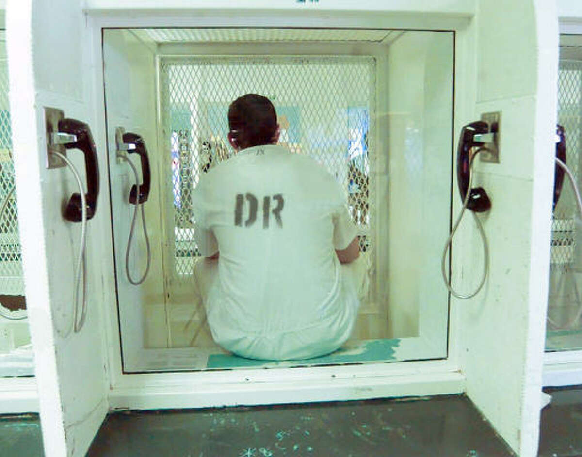 Cameron Todd Willingham waits for guards to take him back to his cell on death row days before his execution on Feb. 17, 2004.
