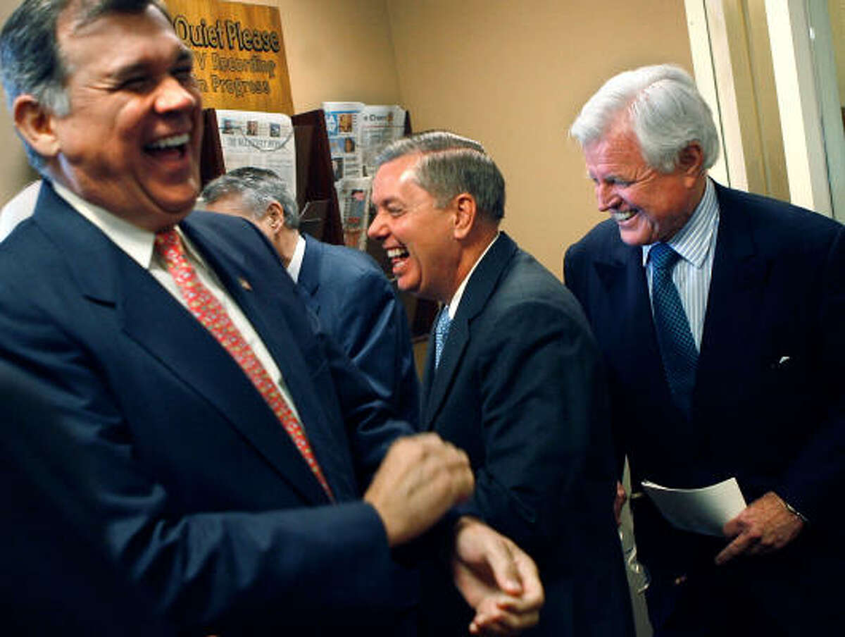 U.S. Sen. Mel Martinez (R-FL), Sen. Lindsey Graham (R-SC) and Sen. Ted Kennedy (D-MA) laugh before a news conference to announce a compromise on immigration legislation between the White House and the Senate at the U.S. Captiol Thursday in Washington, DC. Kennedy was key in negotiating the compromise language in the bill, which U.S. President George W. Bush is expected to sign.