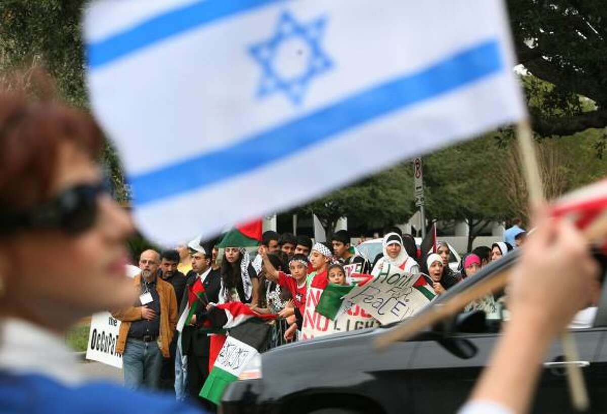 The violence in Gaza drew hundreds of pro-Palestinian protesters Friday to the Embassy of Israel on Weslayan. About a dozen counterprotesters set up a pro-Israel rally across the street.