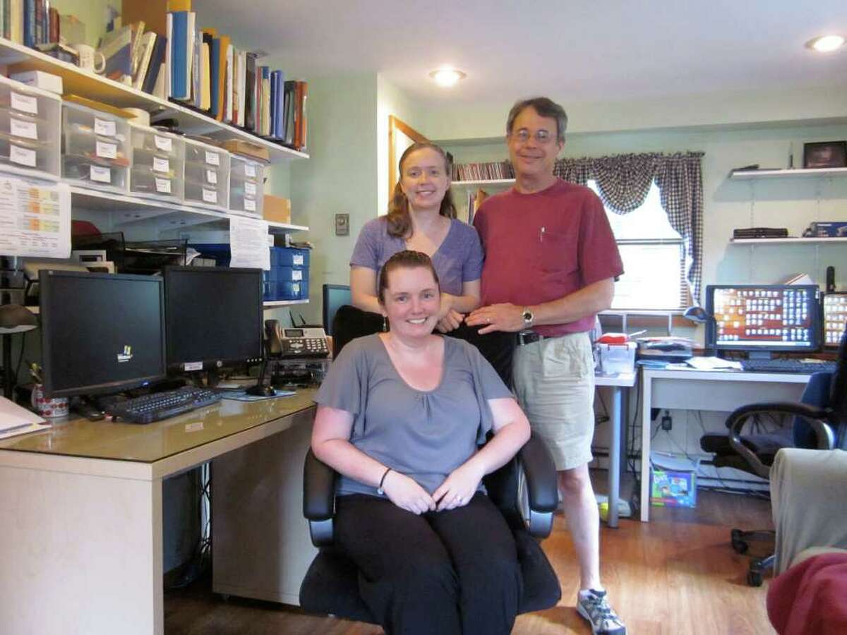Darien-based My Tutor and Me is celebrating 10 years of helping provide high-quality tutors for area students. Seated is office manager Erin Bennedum, and from left to right, company founders Shannon and Fred Converse. - Photo by John H. Palmer
