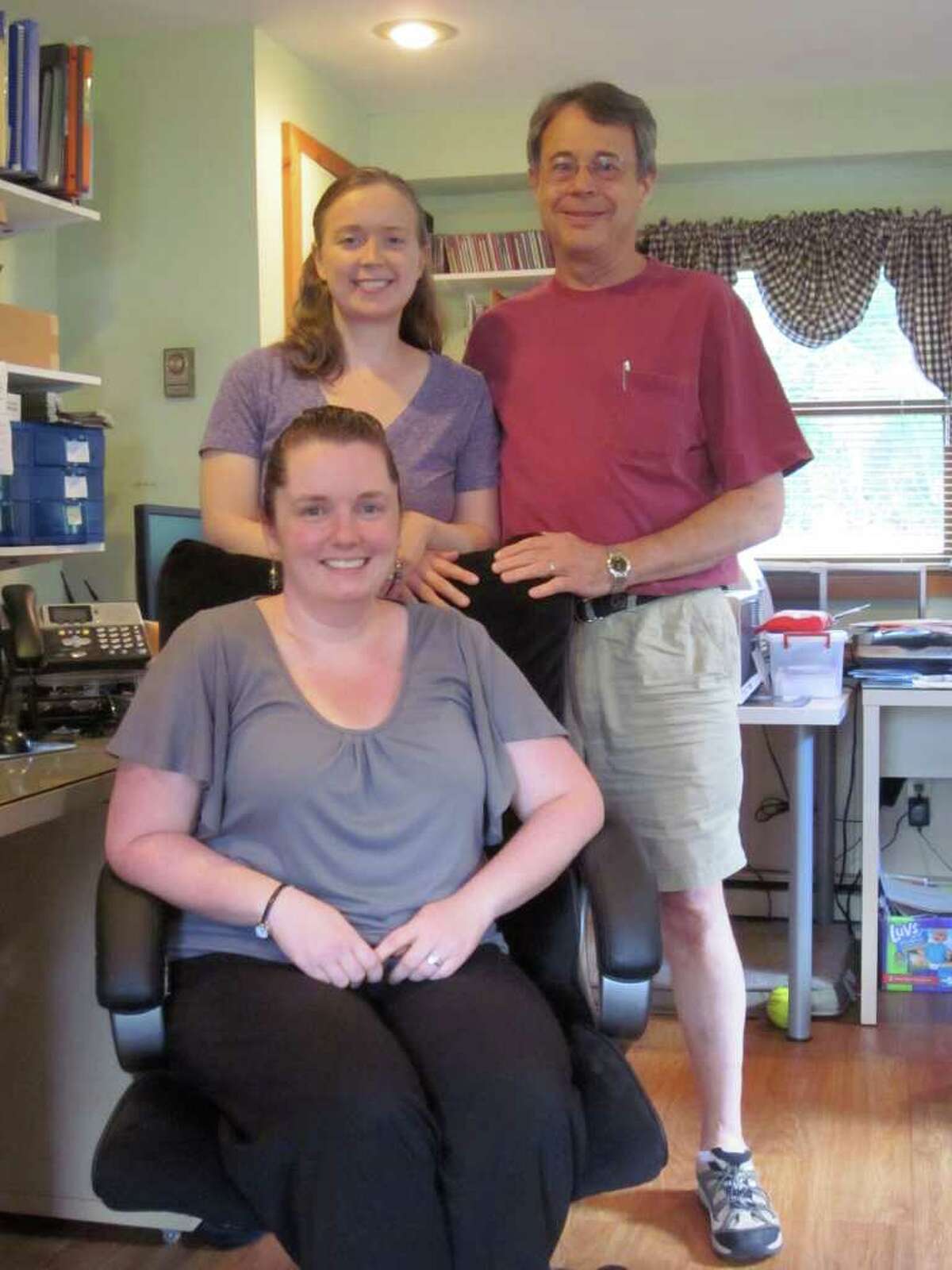 Darien-based My Tutor and Me is celebrating 10 years of helping provide high-quality tutors for area students. Seated is office manager Erin Bennedum, and from left to right, company founders Shannon and Fred Converse. - Photo by John H. Palmer