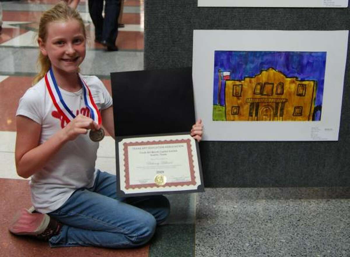 NICE JOB: Oak Forest Elementary fourth grader Bethany Hellmer learned that her that her artwork, ?The Alamo,? has been selected to hang in Governor Perry?s business office.