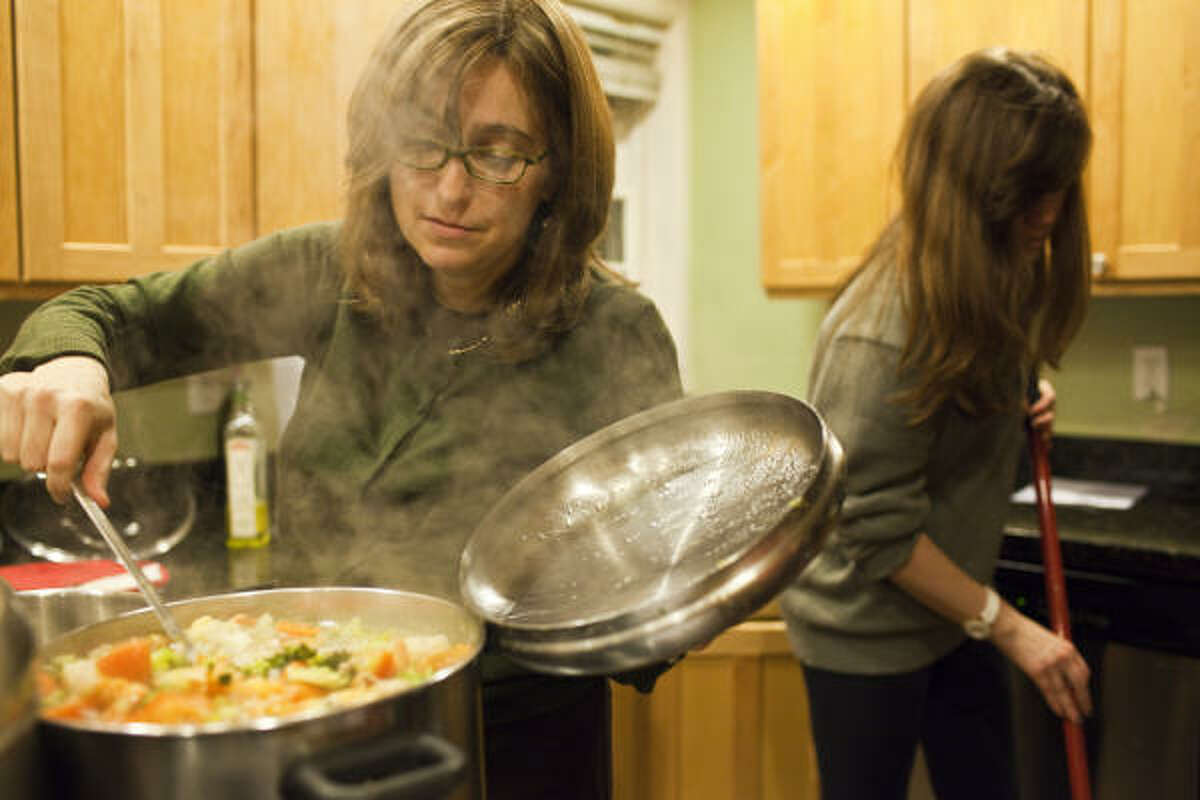 Rochel Lazaroff prepares meals for visitors at Aishel House. "Everything revolves around the ill person, and basic things like a warm meal get put aside because everything else becomes inconsequential," she said of the families staying there.