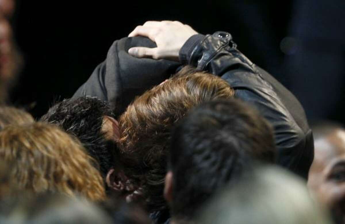 Smooch. Robert Pattinson, right, kisses Taylor Lautner.