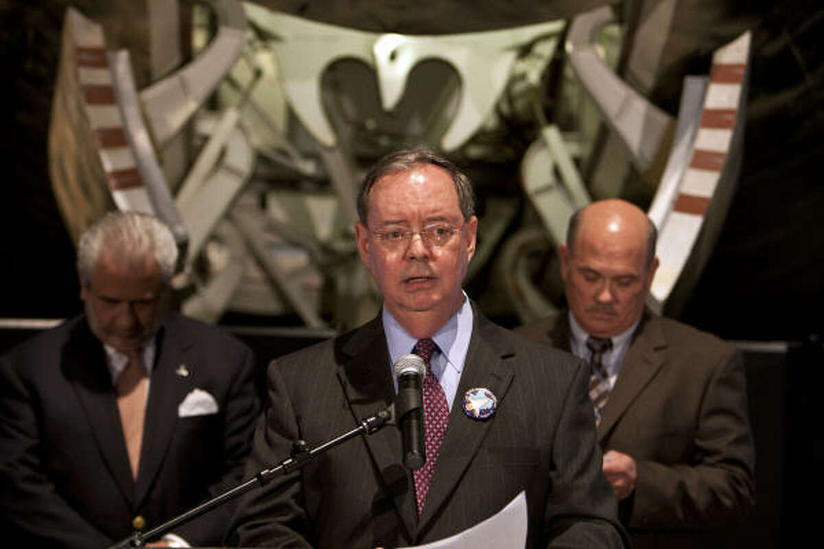 Space Center Houston president and CEO Richard Allen speaks as Bob Mitchell, right, president of the Bay Area Houston Economic Partnership, and the Greater Houston Partnership's Denis Braham, look on during the announcement of the retirement locations for the space shuttles at Space Center Houston Tuesday, April 12, 2011, in Houston. Shuttles will be going to the Smithsonian Institution, the Intrepid Sea, Air and Space Museum in New York, the Kennedy Space Center in Florida and the California Science Center in Los Angeles.
