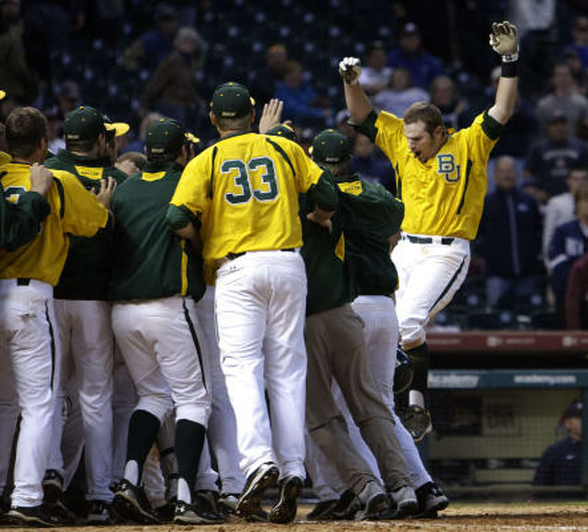 March 6: Baylor 12, Rice 8 (10 innings) Baylor's Max Muncy, right, is greeted at home by his teammates after hitting a grand slam in the bottom of the tenth inning to give Baylor the win over Rice.