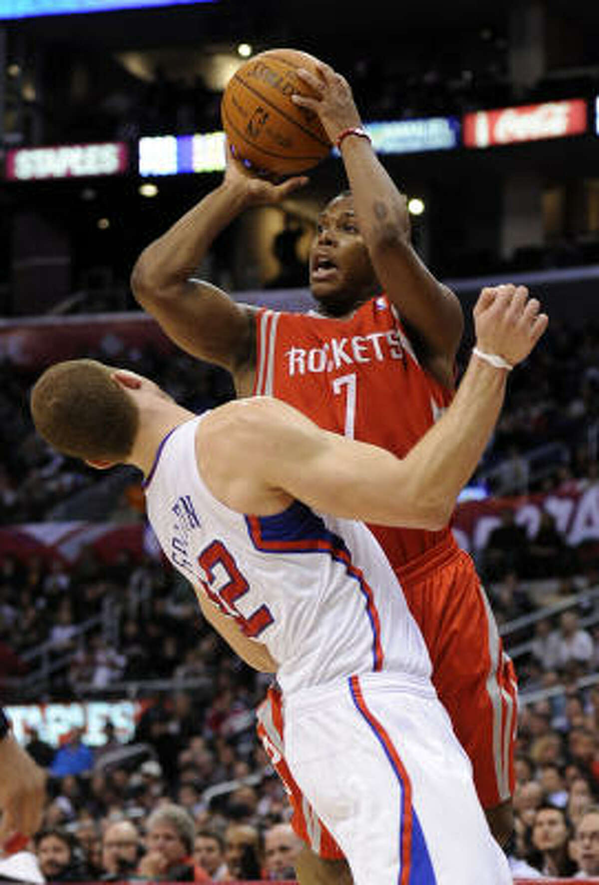Rockets guard Kyle Lowry, right, is fouled by Clippers forward Blake Griffin as he shoots during the first half.