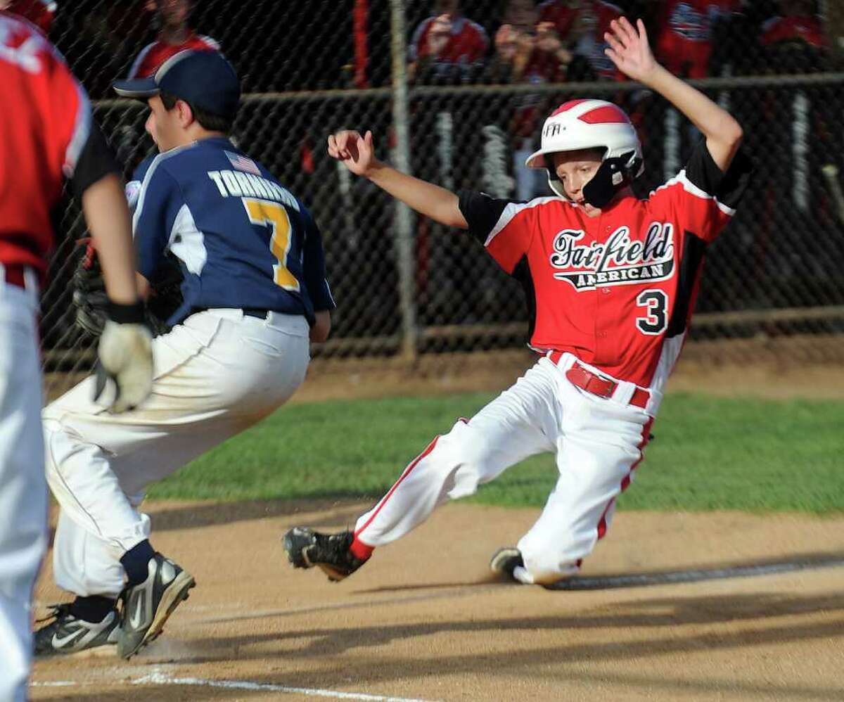 Philip Vlandis scores a run during Wednesday's Fairfield American Little League Section 1 Championship game against East Haven in Orange on July 27, 3011.