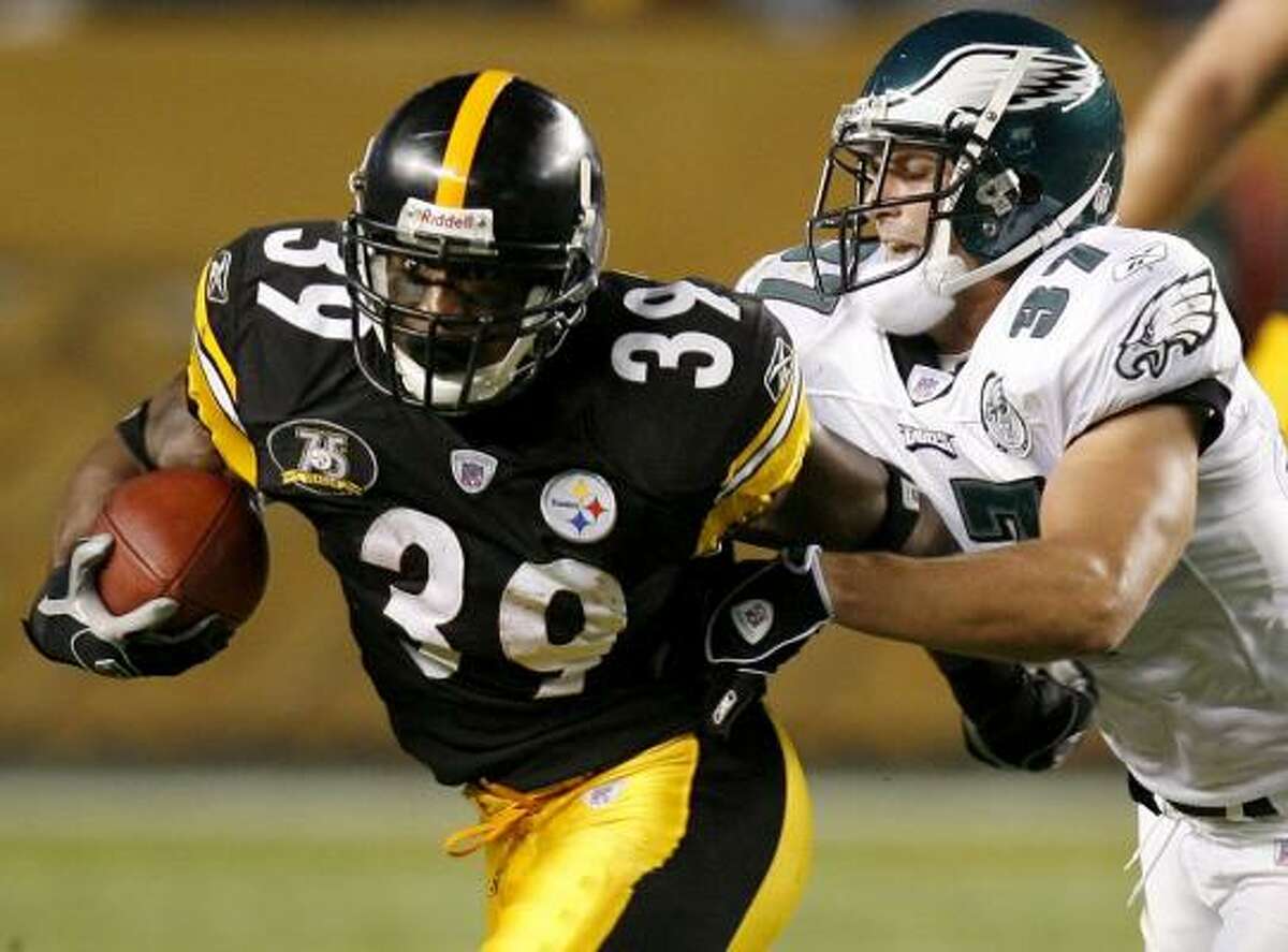 Willie Parker, who scored the Steelers' first touchdown, tries to shake the Eagles' Sean Considine.